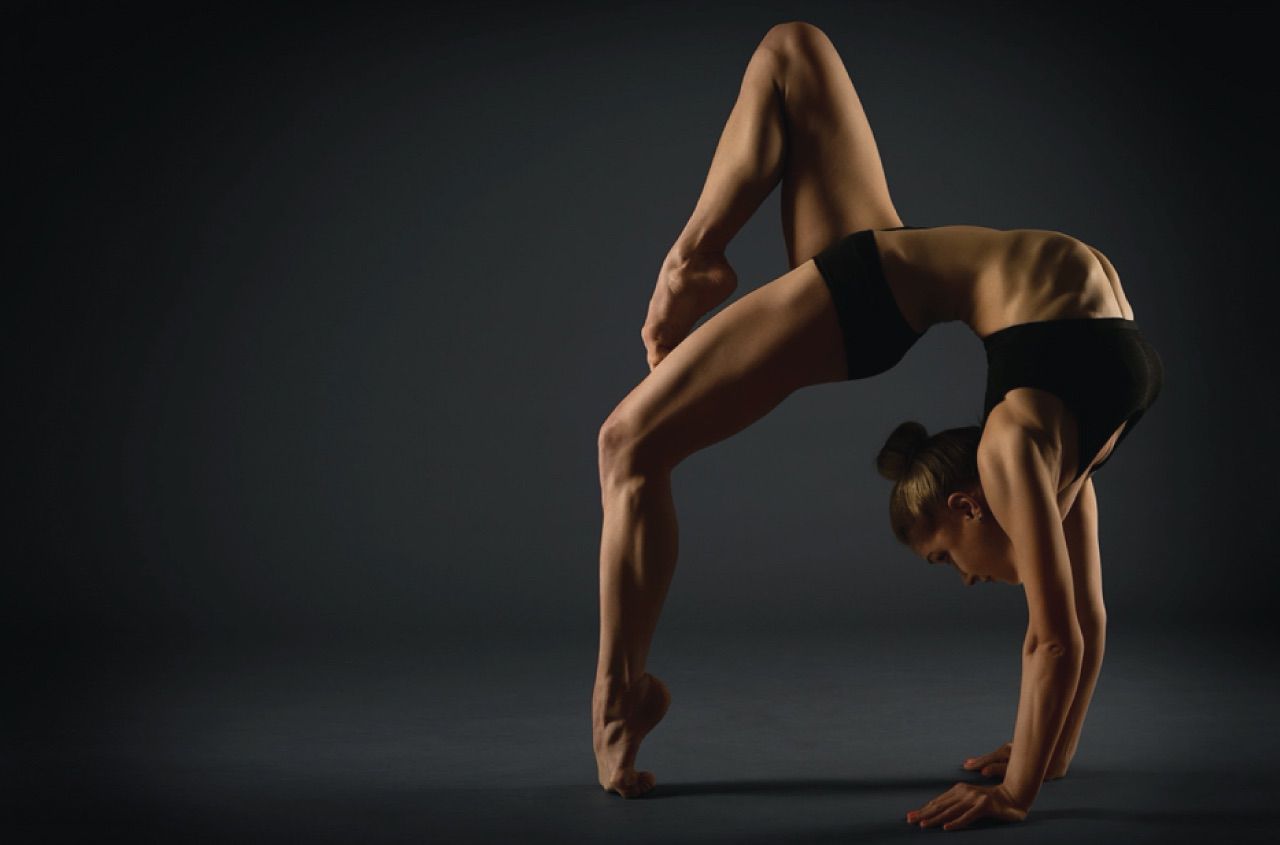 Gymnast performing a back bend experiencing no pain